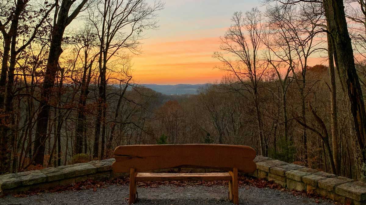 Overlook in the park with a bench at sunset