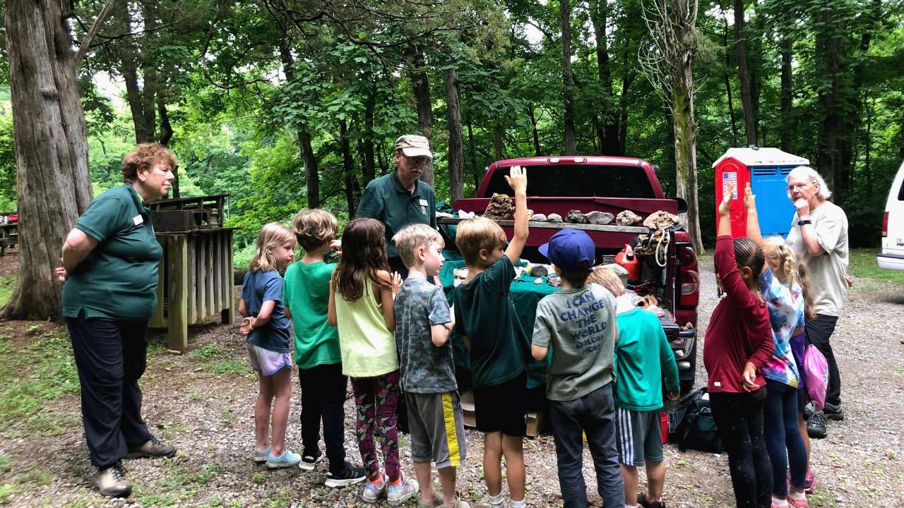 children hiking with naturalists