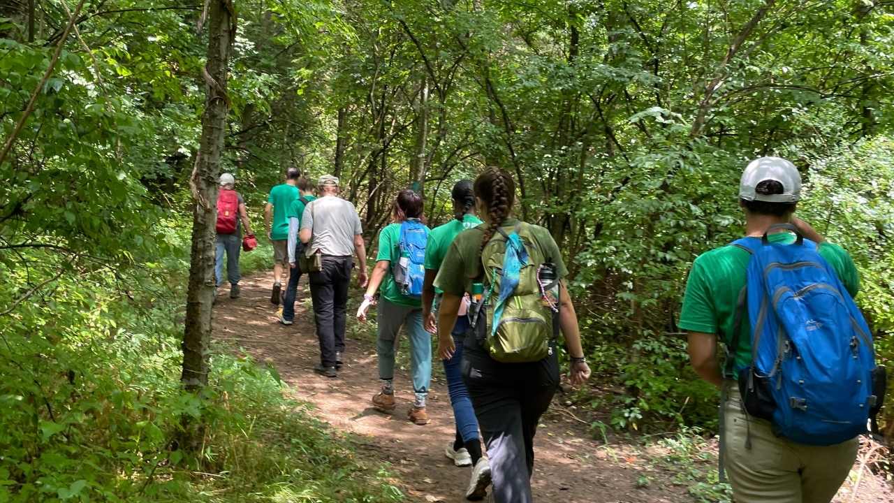 Group of people hiking on a trail