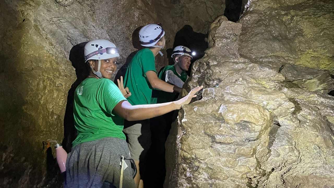 People exploring in a cave