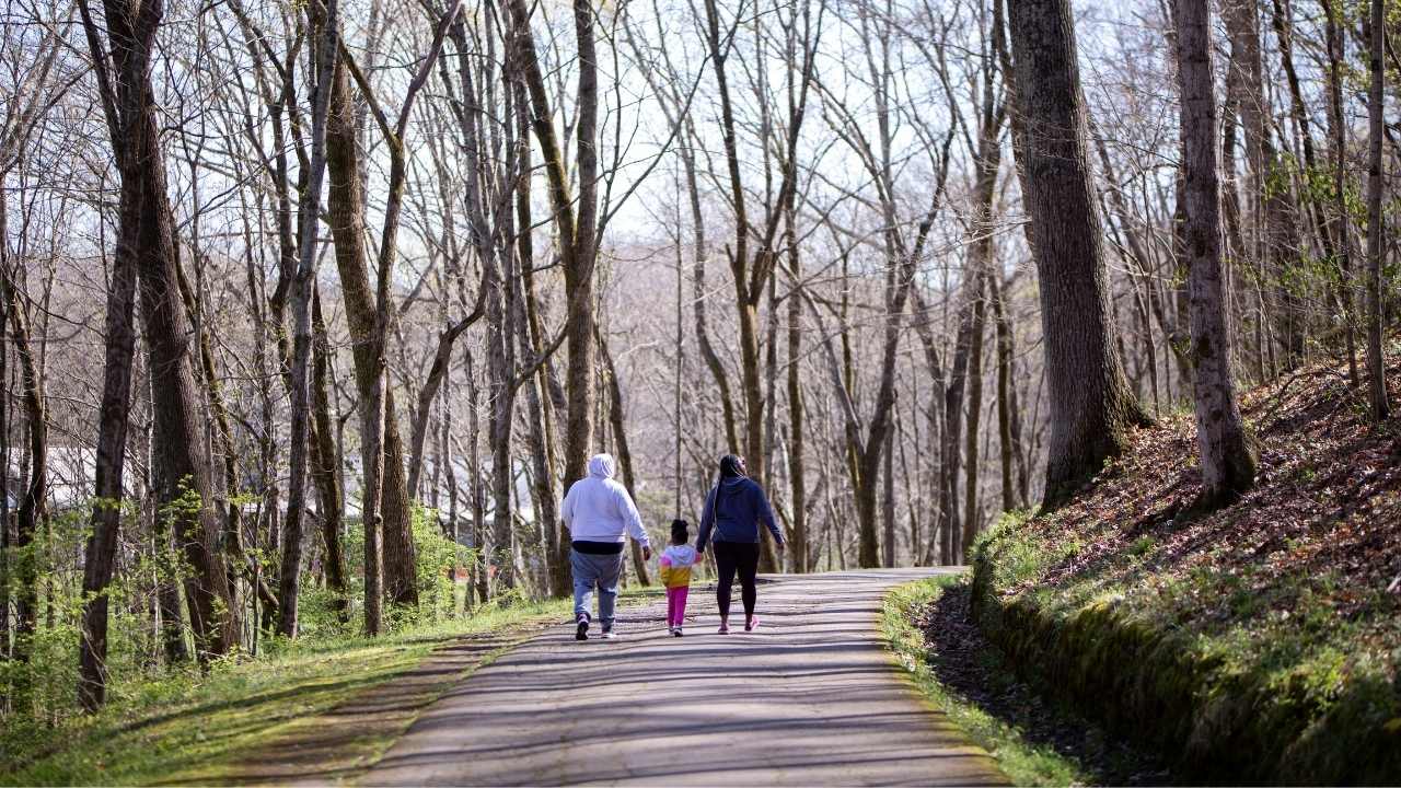 Family walking paved trail in Warner Parks.