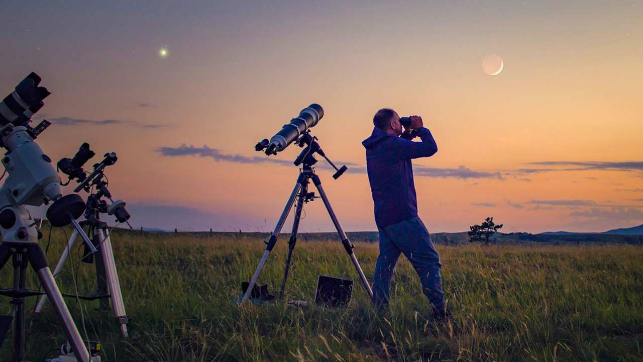 People observing stars through a telescope