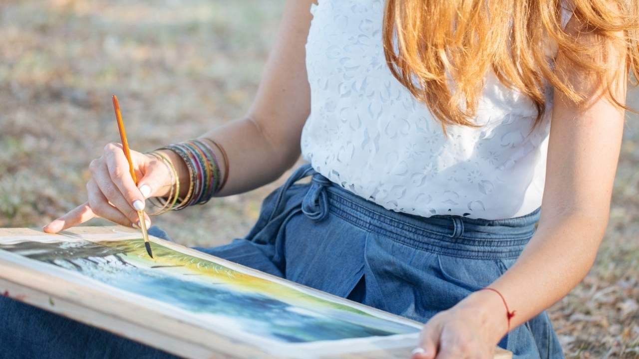 person painting outside