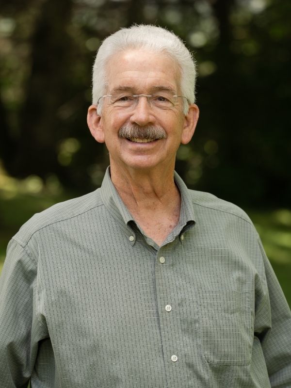 Man smiling in field