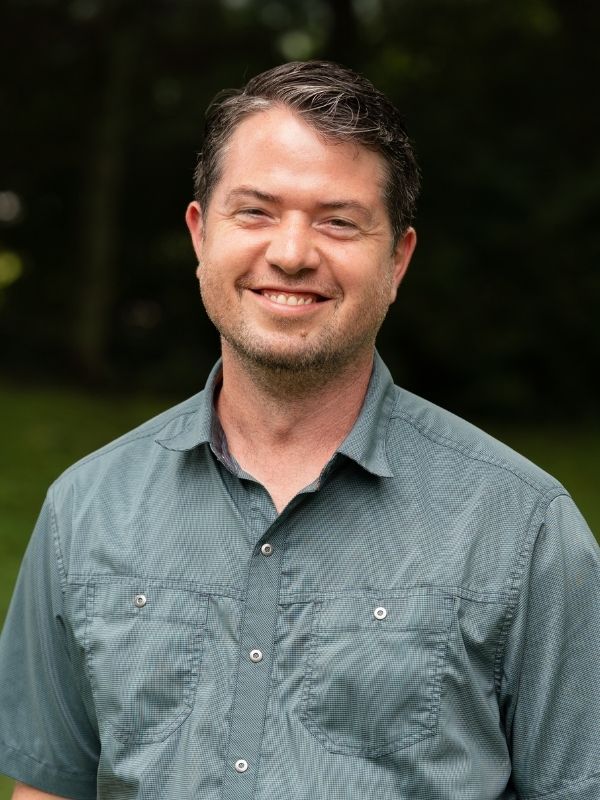 Man smiling in field