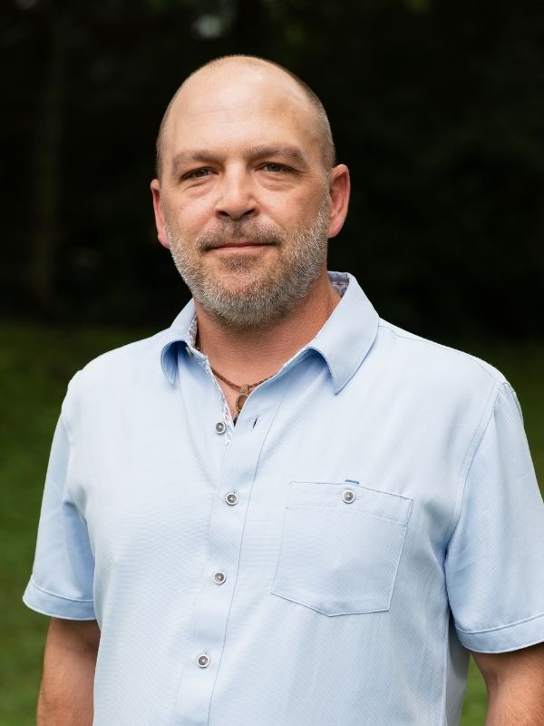 Man smiling in field